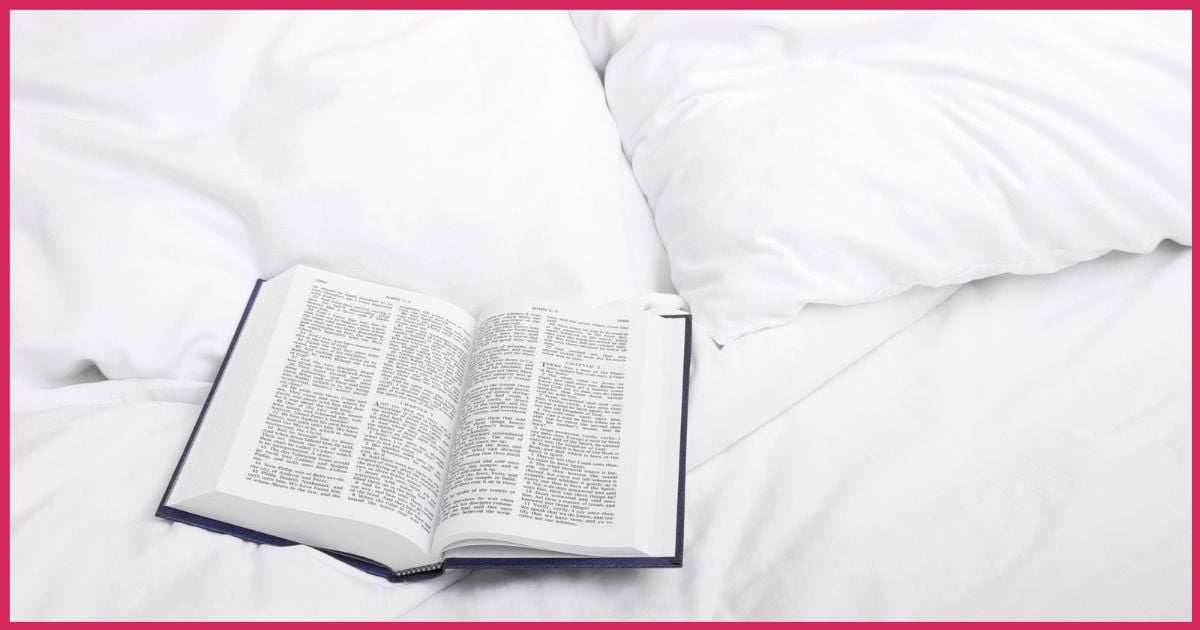 The Holy Bible left open on a hotel bed