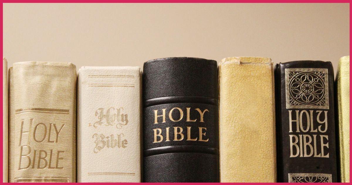 stack of holy bibles together on a bookshelf